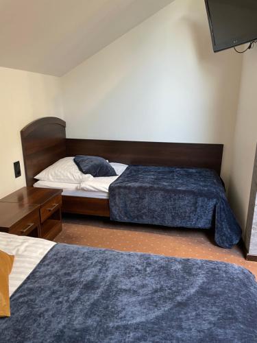 Postel nebo postele na pokoji v ubytování Hotel Jaśmin