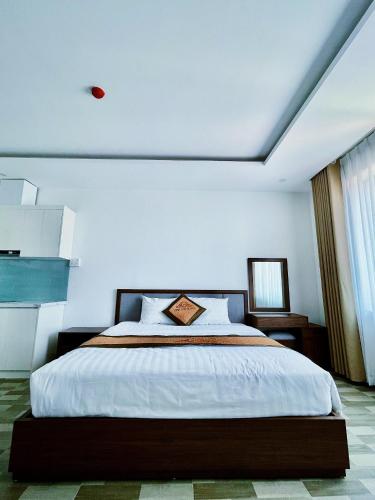 Postel nebo postele na pokoji v ubytování Minh Anh Hotel & Apartment