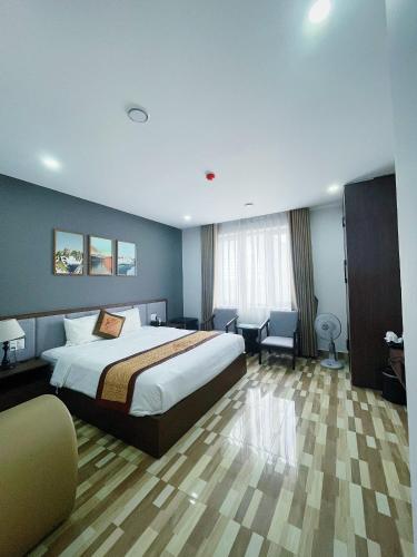 Postel nebo postele na pokoji v ubytování Minh Anh Hotel & Apartment