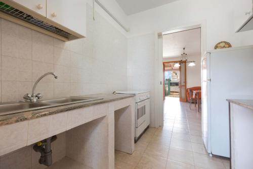 A kitchen or kitchenette at Villino Amos by BarbarHouse