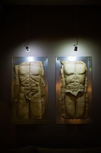 two pieces of art on display in a museum at Acropolis Select in Athens