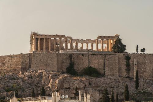 an ancient building on top of a mountain at Acropolis Select in Athens