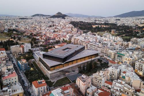 an aerial view of a city with buildings at Acropolis Select in Athens
