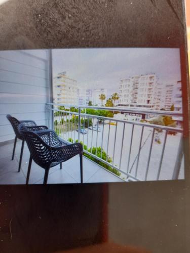 a picture of two chairs on a balcony at Daire in Antalya