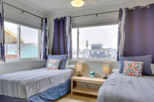 a bedroom with two beds and a window at Luxury Galveston Retreat - Walk to Pirates Beach! in Galveston