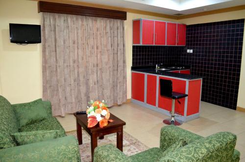TV a/nebo společenská místnost v ubytování Al Thill Hotel