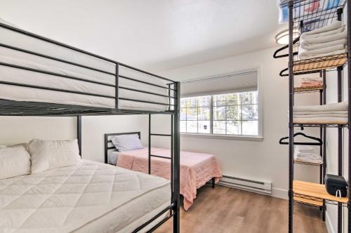 a bedroom with two bunk beds and a window at The Cottages Ski-InandOut Retreat - Hike and Explore! in Beaver