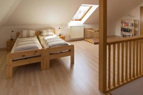 Postel nebo postele na pokoji v ubytování Ferienhaus Deichläufer Norddeich