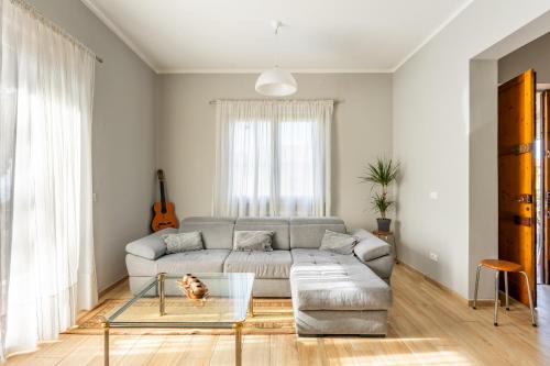 a living room with a couch and a table at Casa Vacanze Tuscan Retreat in Macchino