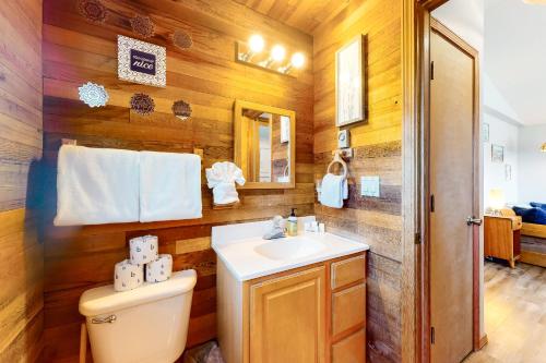 a bathroom with a toilet and a sink at Cabin at the Beach MCA 1263 in Manzanita