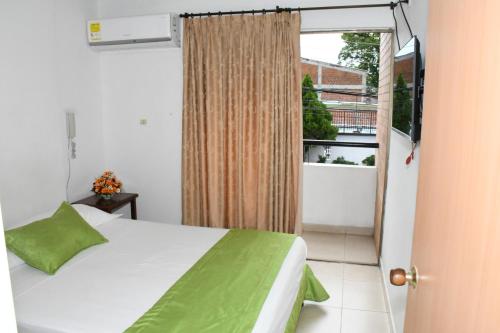 Postel nebo postele na pokoji v ubytování Apartahotel Los Cerezos