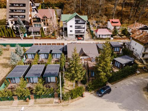 an aerial view of a house with solar panels on it at Moon Montana Busteni in Buşteni