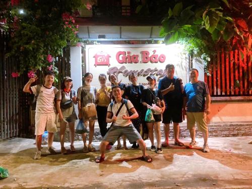a group of people standing in front of a store at Gia Bảo Homestay - Cao Bằng in Cao Bằng
