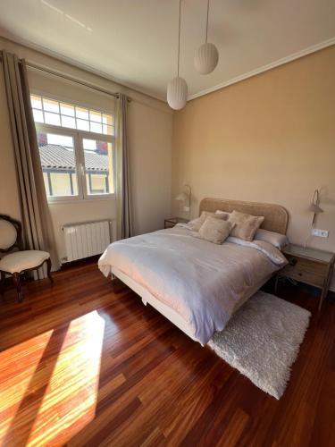 Una cama o camas en una habitación de Haizea