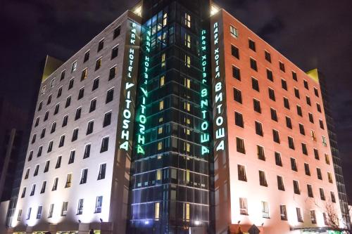 a building with green lights on the side of it at Vitosha Park Hotel in Sofia