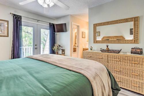 a bedroom with a bed and a large mirror at Gulf Breeze Vacation Rental 5 Mi to Beach! in Gulf Breeze