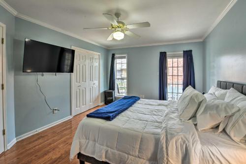 a bedroom with a bed and a ceiling fan at Pet-Friendly Lafayette Vacation Rental! in Lafayette