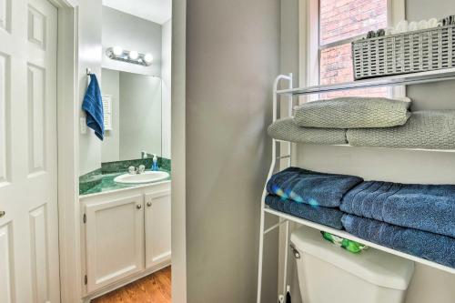 a bathroom with a sink and a mirror and towels at Pet-Friendly Lafayette Vacation Rental! in Lafayette