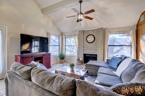 a living room with a couch and a fireplace at 4 Mi to Joe Pool Lake Home in Grand Prairie in Grand Prairie
