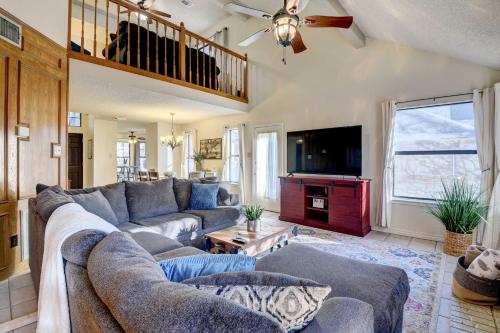 a living room with a couch and a tv at 4 Mi to Joe Pool Lake Home in Grand Prairie in Grand Prairie