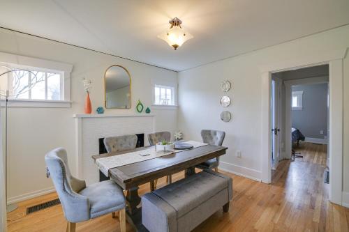 a dining room with a table and chairs at Charming Tacoma Vacation Home with Fenced Yard in Tacoma