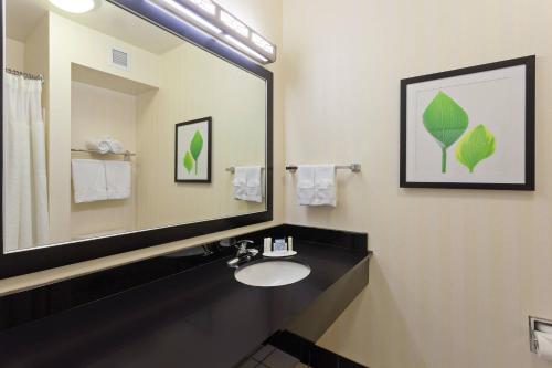 a bathroom with a sink and a large mirror at Fairfield Inn & Suites - Los Angeles West Covina in West Covina