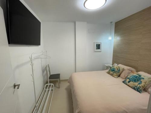 Postel nebo postele na pokoji v ubytování Bajo - Calle Los Perros