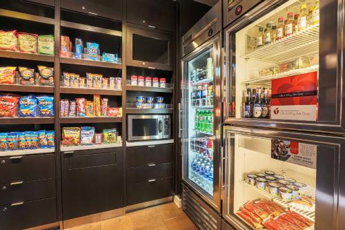 a refrigerator filled with lots of food and drinks at Courtyard Austin Airport in Austin