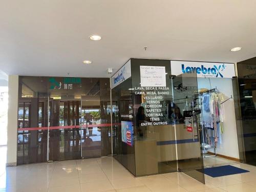 a lobby of a store with a revolving door at Harmonia à Beira do Lago - Life Resort in Brasília