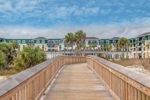 a boardwalk leading to the beach with condos at Courtyard by Marriott Jekyll Island in Jekyll Island