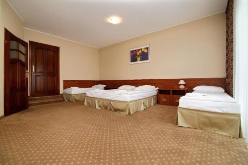 Ein Bett oder Betten in einem Zimmer der Unterkunft Amadeus