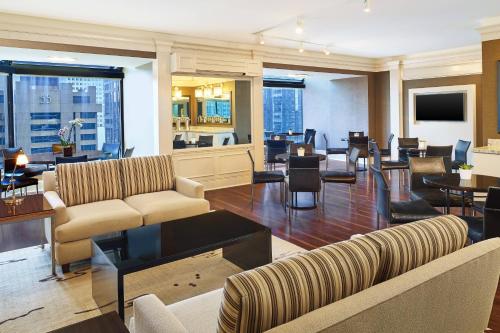 a hotel lobby with couches and chairs and tables at The Westin Chicago River North in Chicago