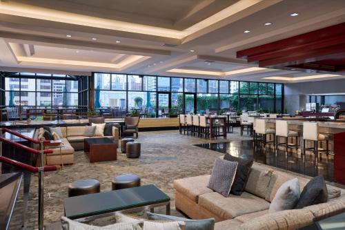 a lobby of a hotel with couches and a bar at The Westin Chicago River North in Chicago