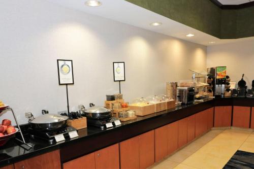 a kitchen with a counter top with pots and pans at Fairfield by Marriott San Antonio Alamo Plaza Convention Center in San Antonio