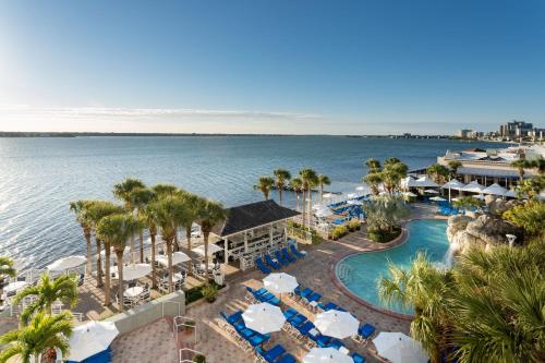 an aerial view of a resort with a swimming pool and the ocean at Clearwater Beach Marriott Suites on Sand Key in Clearwater Beach