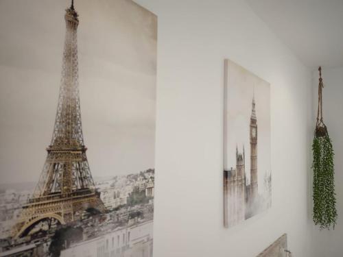 a picture of the eiffel tower next to a wall at Gallaecia in Arzúa