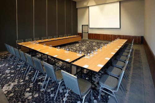 a large conference room with a long table and chairs at Courtyard by Marriott Mexico City Vallejo in Mexico City