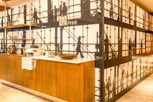 a kitchen with a counter with shadows on the wall at Courtyard by Marriott Mexico City Vallejo in Mexico City