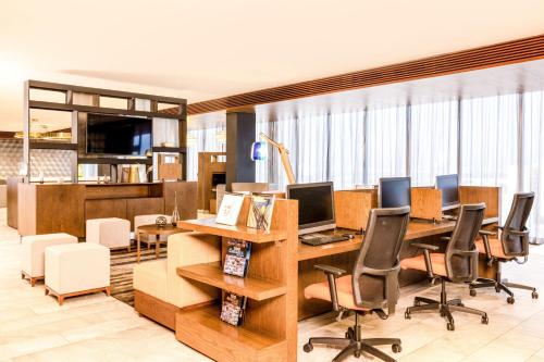 an office with desks and chairs and windows at Courtyard by Marriott Mexico City Vallejo in Mexico City