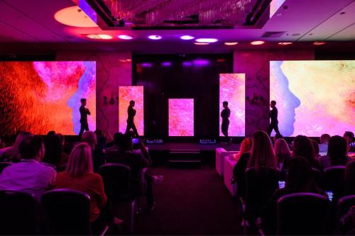 a group of people standing on a stage in a room at Sheraton Lisboa Hotel & Spa in Lisbon