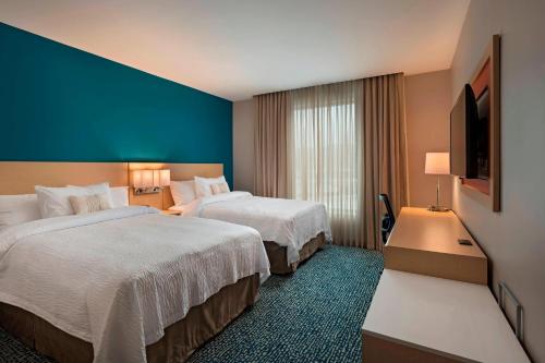 Säng eller sängar i ett rum på Fairfield by Marriott San Salvador