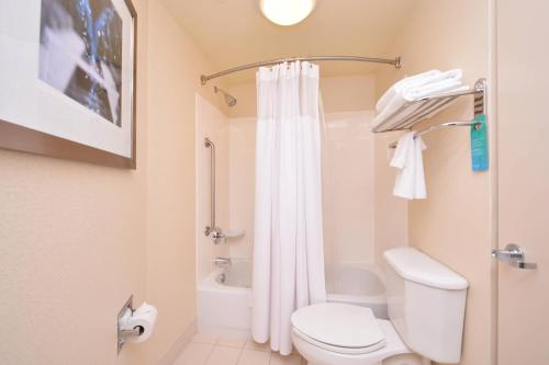 a bathroom with a toilet and a shower at SpringHill Suites Arundel Mills BWI Airport in Hanover