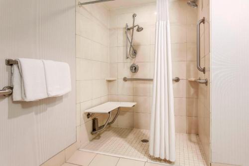 a bathroom with a shower and a sink at Courtyard by Marriott Amarillo Downtown in Amarillo