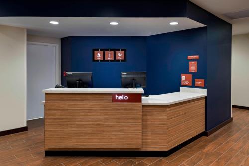 a kia counter in an office with a blue wall at TownePlace Suites by Marriott Tacoma Lakewood in Lakewood