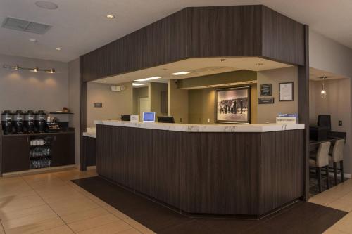 a lobby with a large counter in a store at Residence Inn Durango Downtown in Durango