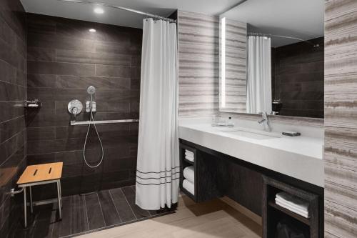 a bathroom with a sink and a shower at Bridgewater Marriott in Bridgewater