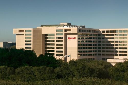 a large building with a namazon sign on it at Houston Marriott Westchase in Houston