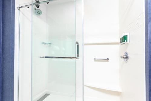 a shower with a glass door in a bathroom at Residence Inn Livermore in Livermore