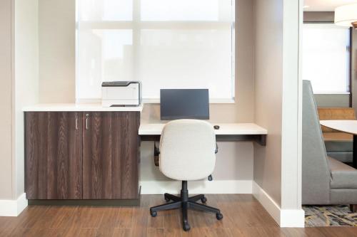 an office with a desk with a computer and a chair at Residence Inn Livermore in Livermore