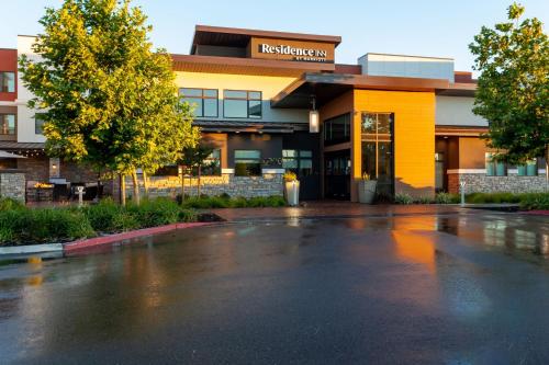 an empty parking lot in front of a building at Residence Inn Livermore in Livermore